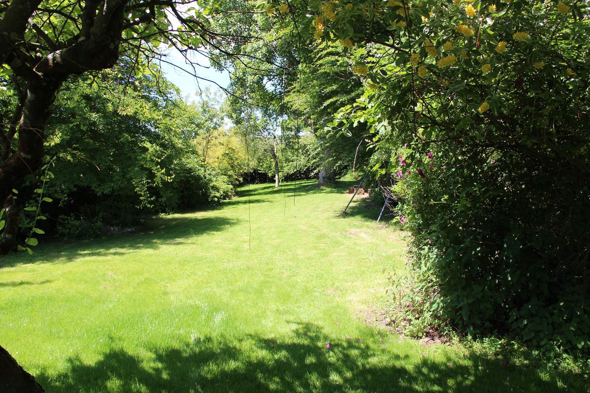Oodles of space for the little ones to let off steam, along with enjoying the swing set which is neatly placed to the right of this shot.