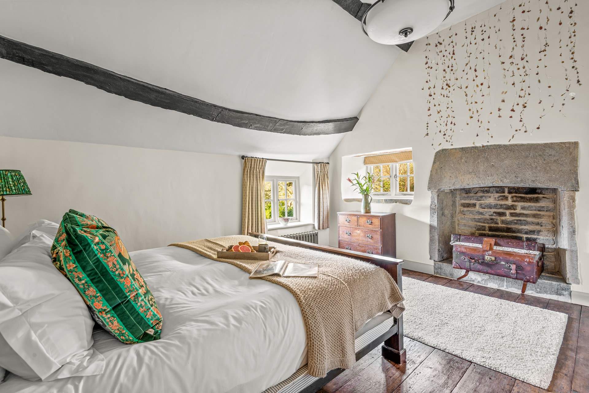 Bedroom 1 boasts a fabulous old stone fireplace.