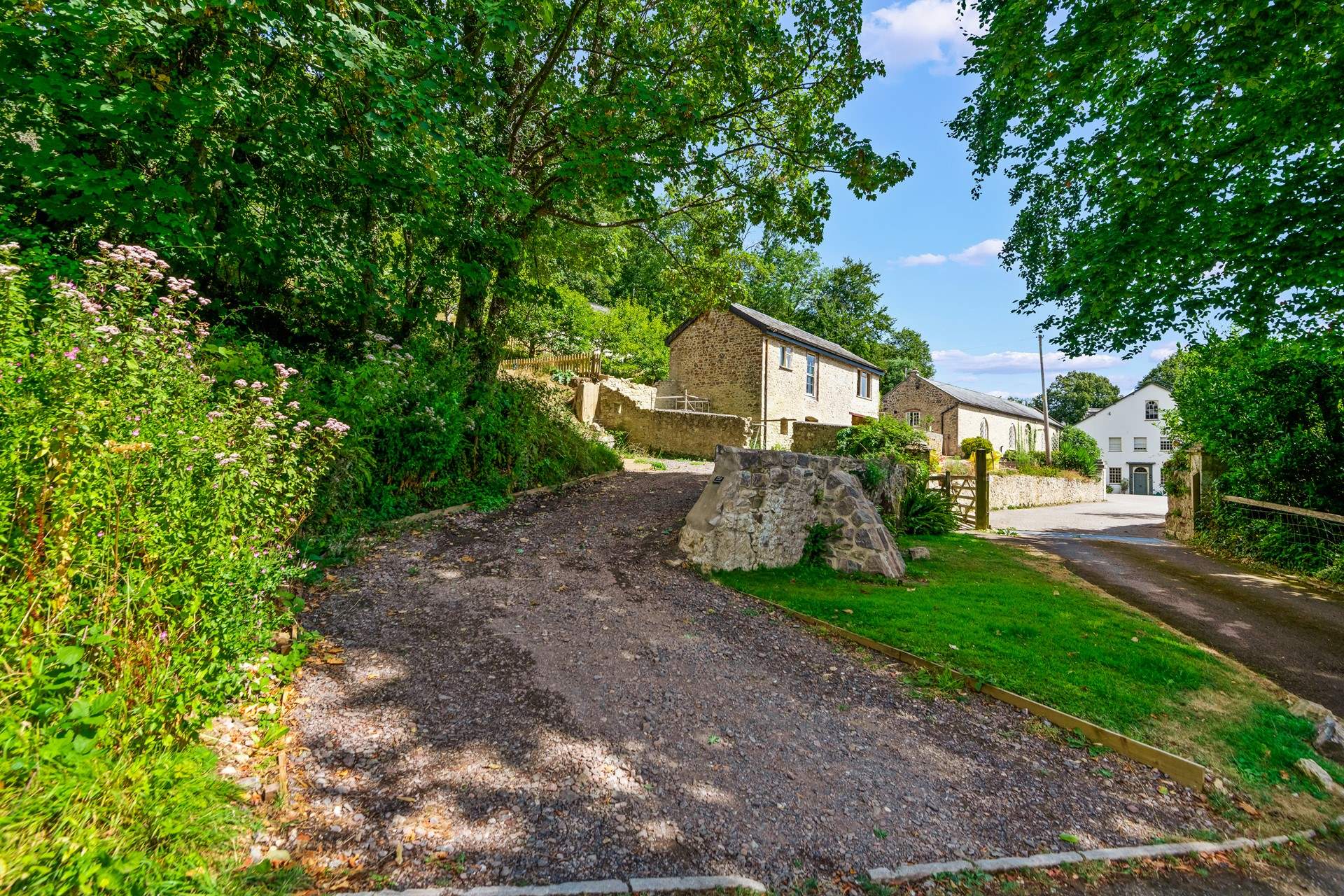 The driveway leading to your parking area.