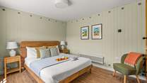 On entering, you will be greeted by the stylish king-size bedroom.