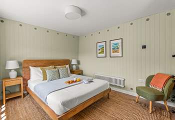On entering, you will be greeted by the stylish king-size bedroom.