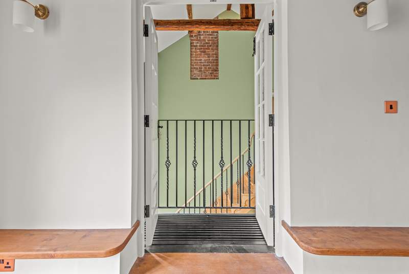 Peek through this quirky balcony into the hallway.