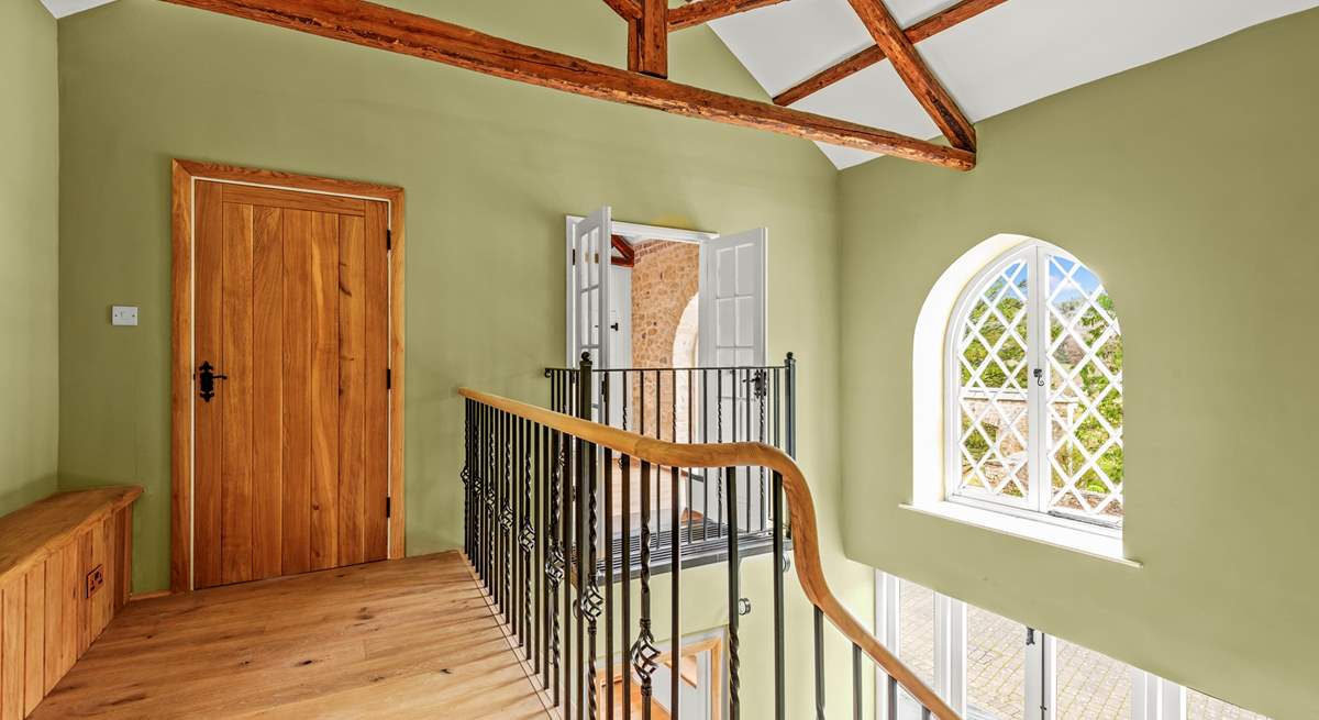 The sweeping staircase takes you to this light and airy landing, which also has superb views.