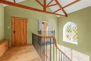 The sweeping staircase takes you to this light and airy landing, which also has superb views.