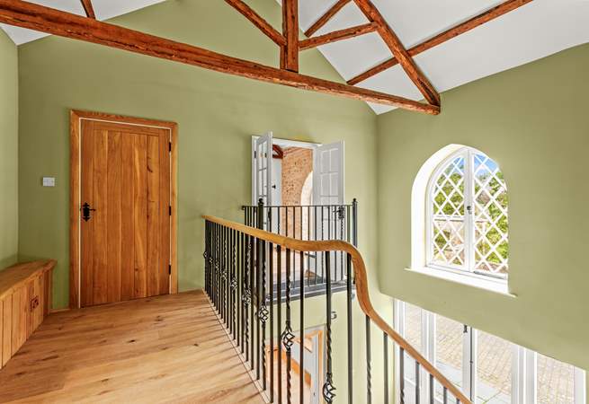 The sweeping staircase takes you to this light and airy landing, which also has superb views.