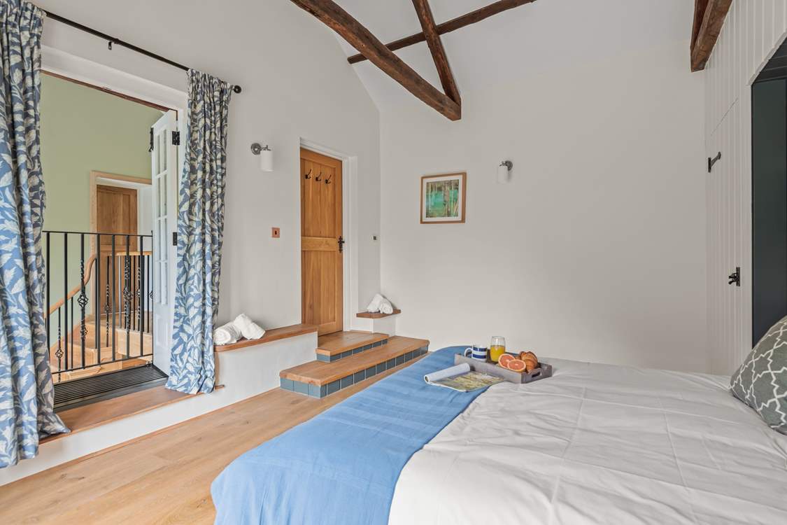 Peeking out on the landing from Bedroom 3. Please take care on the step when entering and exiting the bedroom.