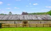 Looking back at The Coach House from the patio table. Entrance to the living-area is through the patio doors. - Thumbnail Image