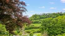 You can access a public tennis court just below The Coach House.