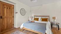 Super comfy King-size bed awaits you in Bedroom 1.