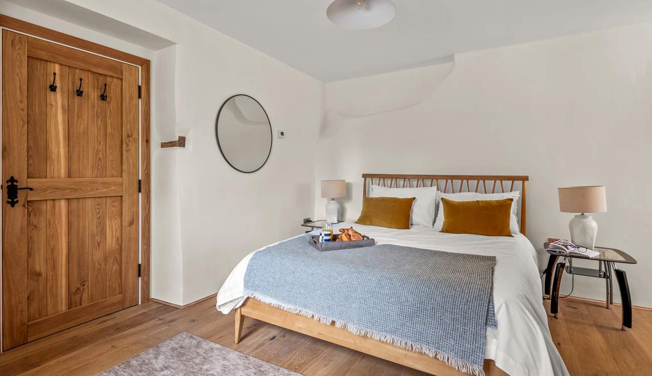 Super comfy King-size bed awaits you in Bedroom 1.