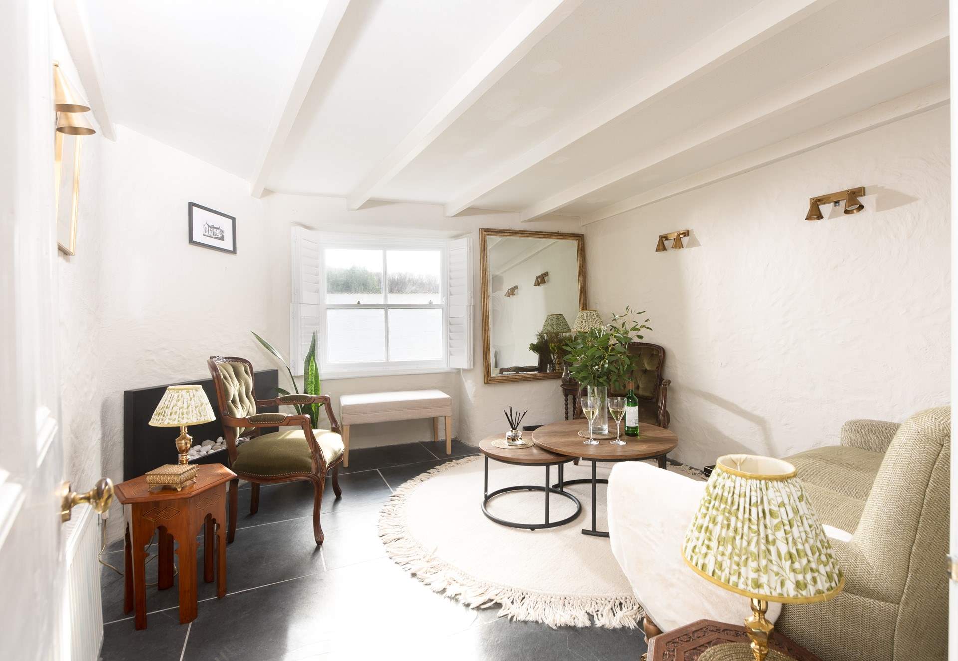 Inside is exquisitely styled, this sitting-room is a very special space to relax at the end of the day.