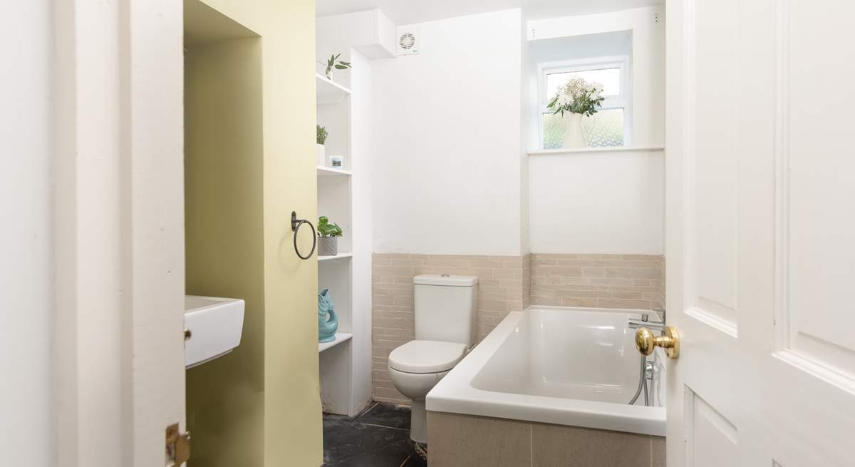 The bathroom is on the ground floor and features a bath with a separate shower cubicle.