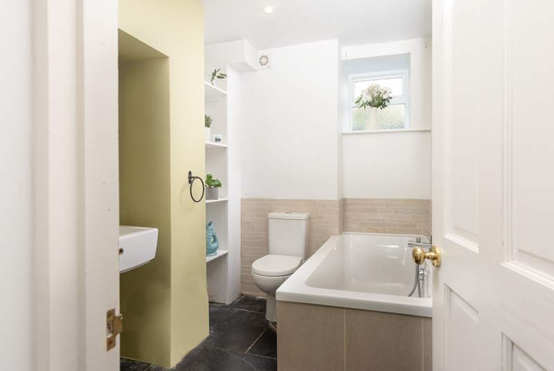 The bathroom is on the ground floor and features a bath with a separate shower cubicle.