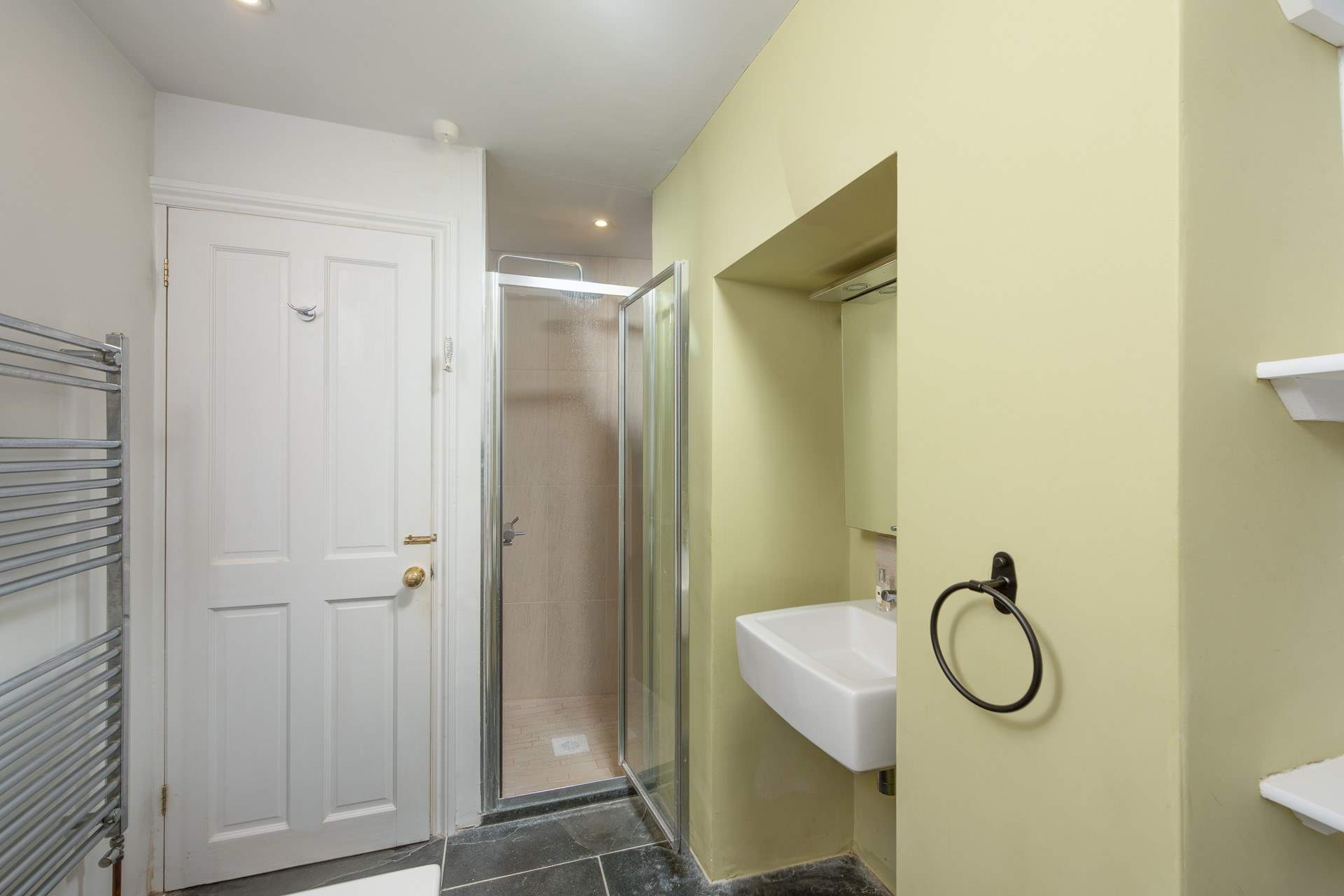 The shower door is slightly narrower than normal.