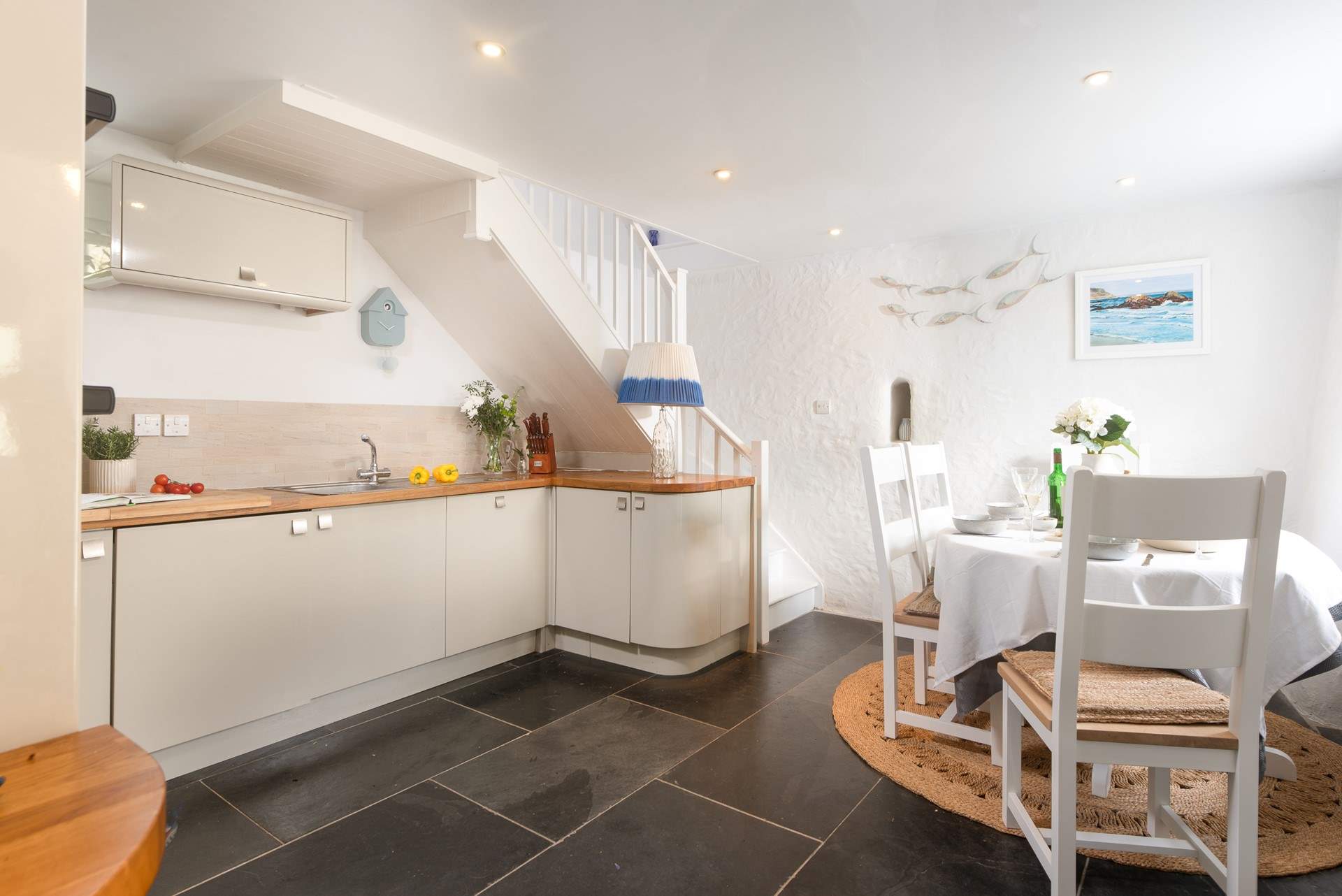 Grand flagstone flooring, mined from the local quarry. Please note the lower ceiling height to the right side of the kitchen counter.