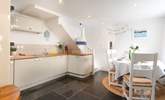 Grand flagstone flooring, mined from the local quarry. Please note the lower ceiling height to the right side of the kitchen counter. - Thumbnail Image