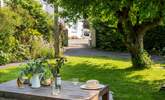 The garden is parallel to the cottage, and is sheltered from the elements in the cooler months, and a sun trap in the summertime. - Thumbnail Image