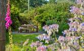 The stunning private garden is an oasis in the summertime. - Thumbnail Image