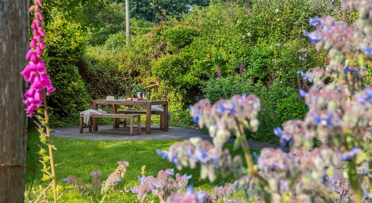 The stunning private garden is an oasis in the summertime.