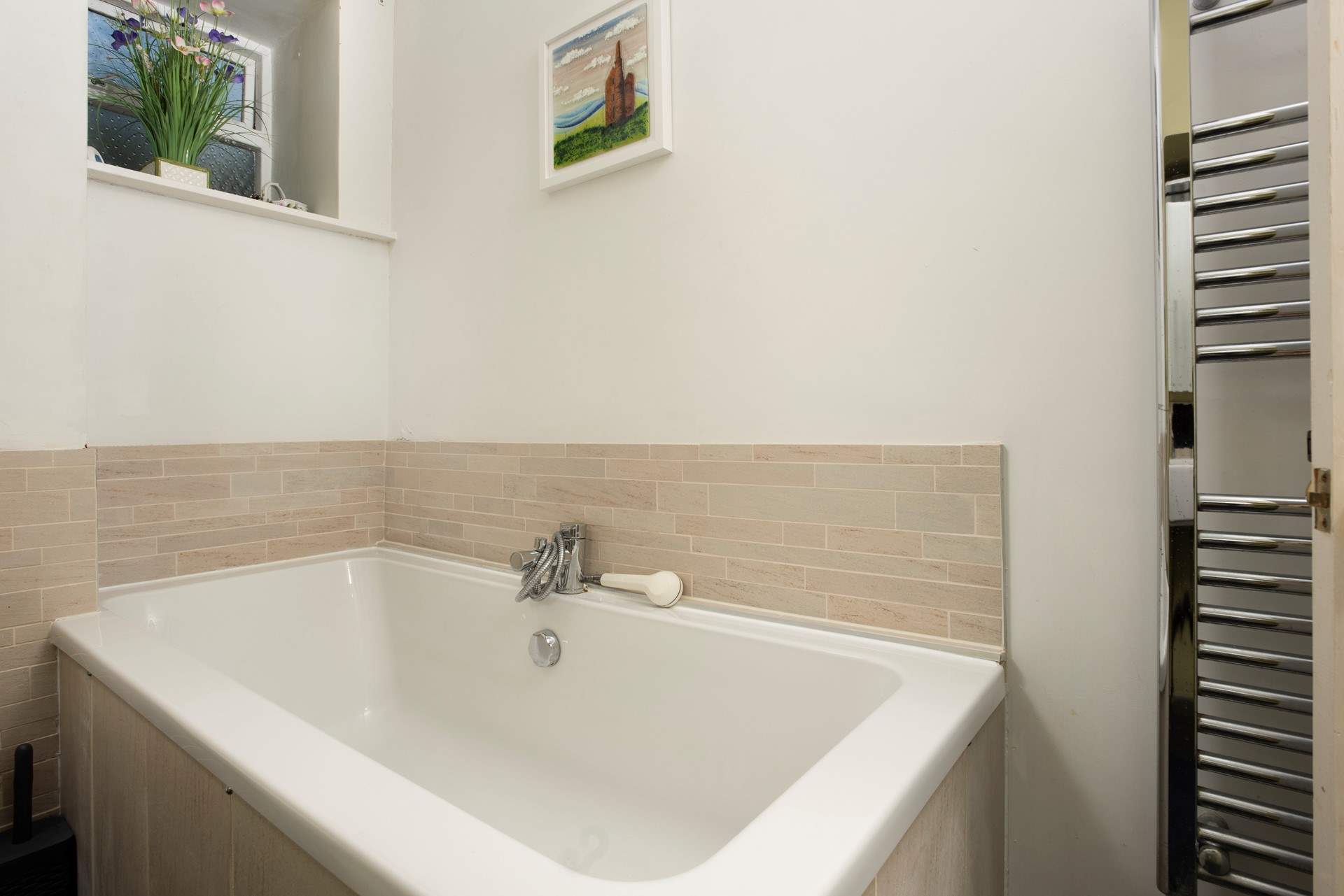 The bathroom is on the ground floor and also has a separate shower cubicle.