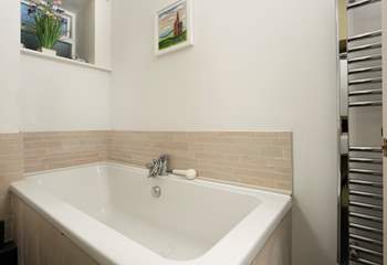 The bathroom is on the ground floor and also has a separate shower cubicle.
