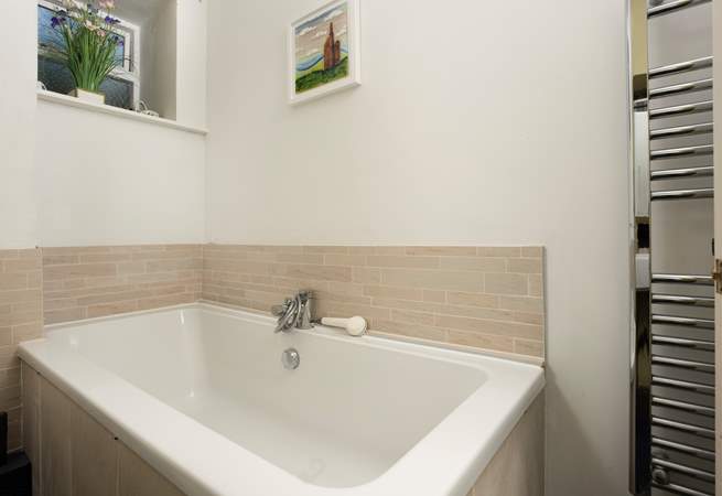 The bathroom is on the ground floor and also has a separate shower cubicle.