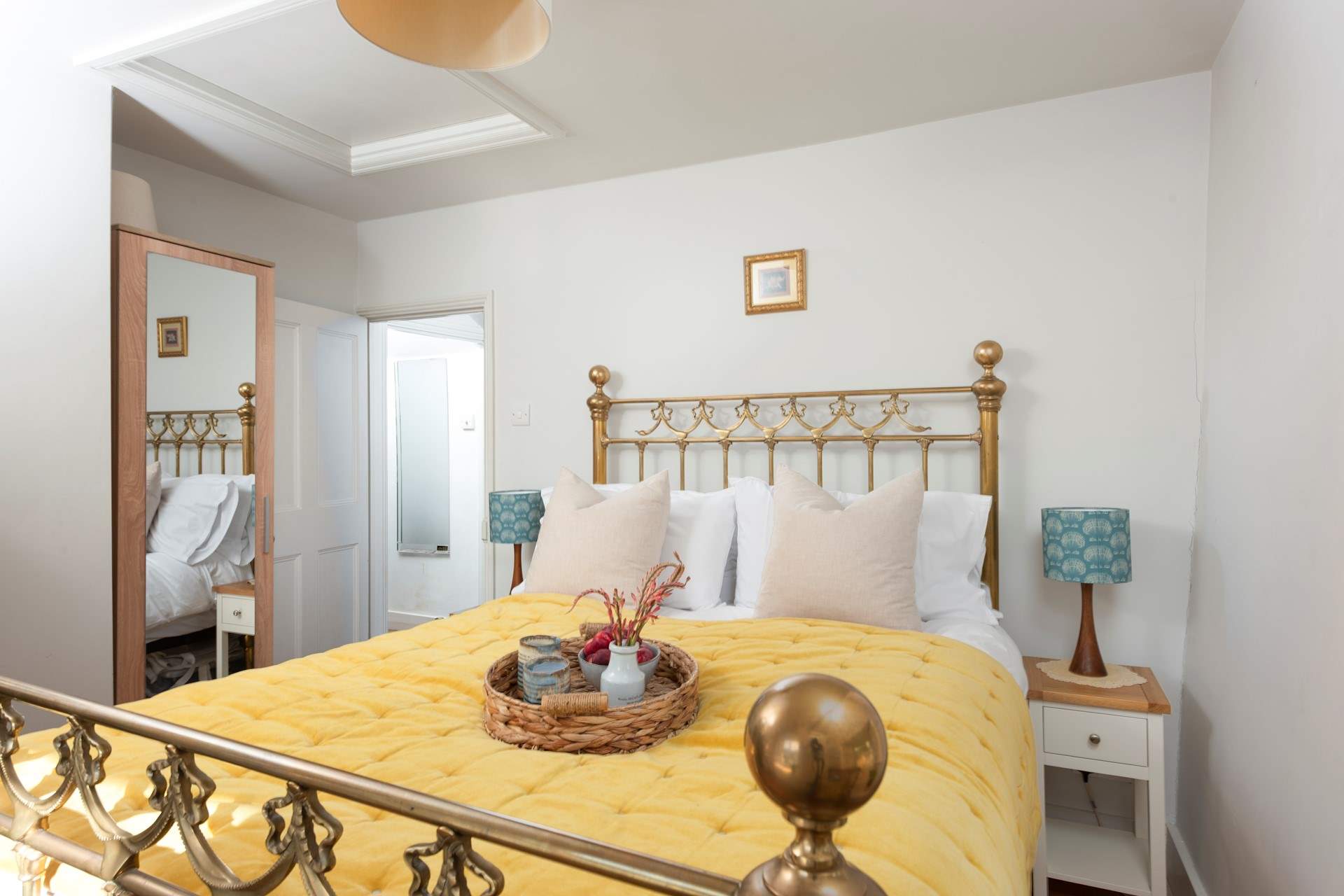 Bedroom 1 features a magnificent brass bed.