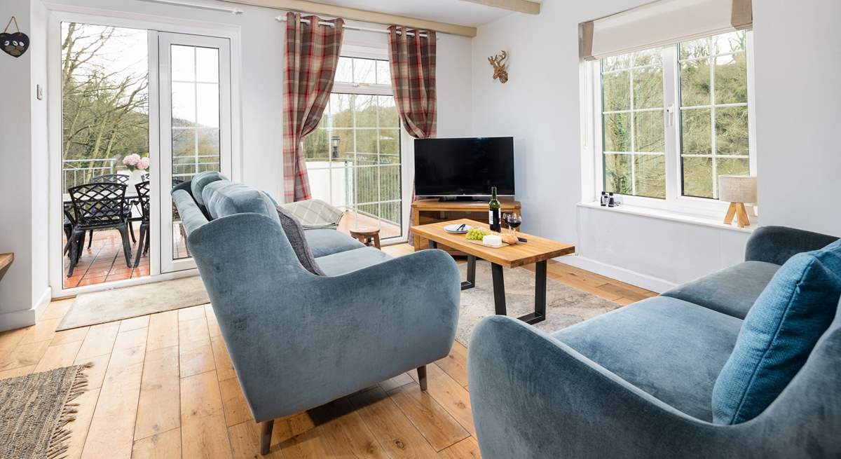 Flooded with natural light and panoramic views, the sitting room is a joy. 