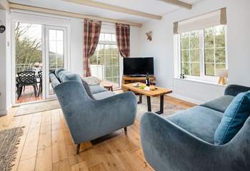 Flooded with natural light and panoramic views, the sitting room is a joy. 