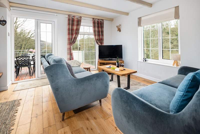 Flooded with natural light and panoramic views, the sitting room is a joy. 