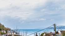 Gaze out across the pretty sea view from the sitting-room, garden and the two double rooms. 
