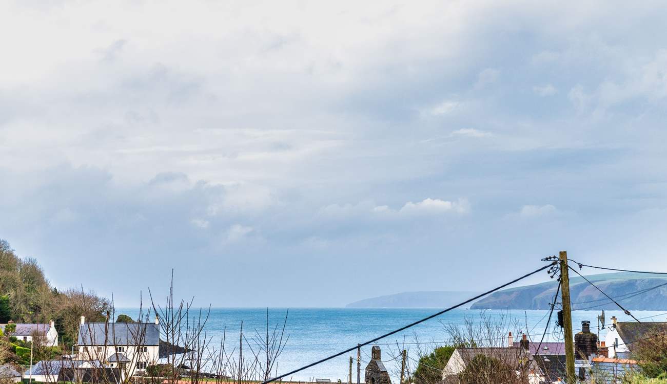 Gaze out across the pretty sea view from the sitting-room, garden and the two double rooms. 