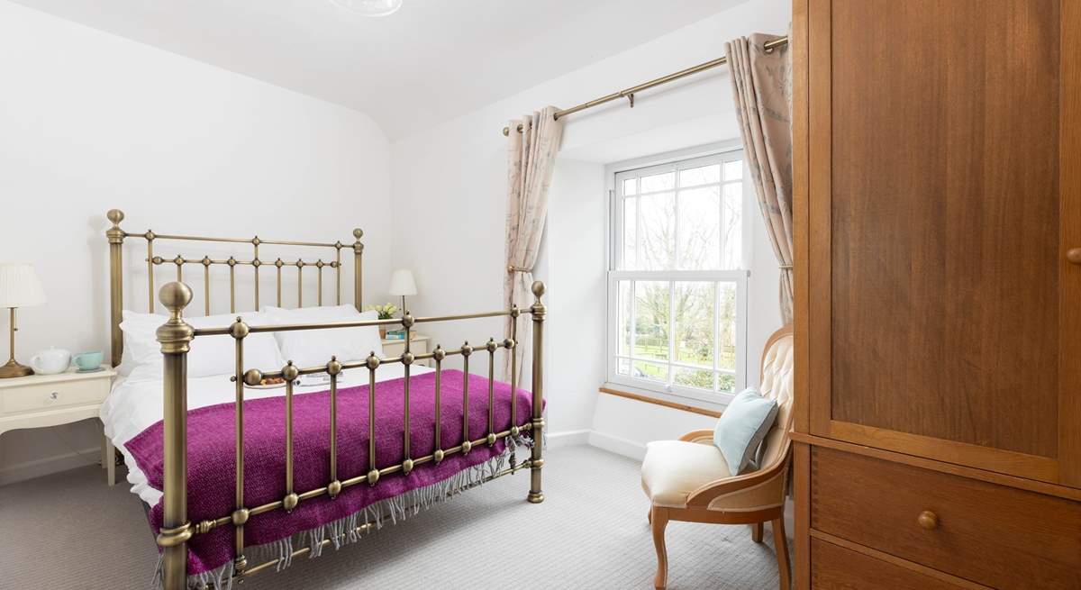 The pretty double bedroom with far-reaching views.