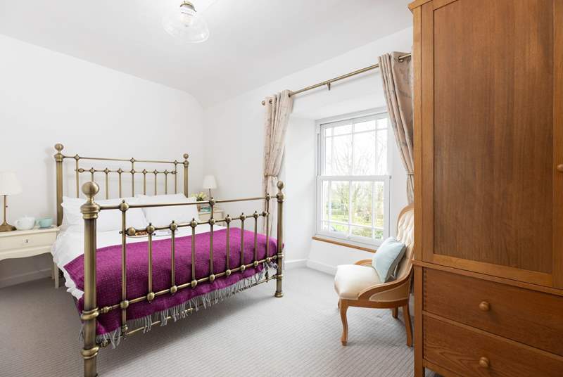 The pretty double bedroom with far-reaching views.
