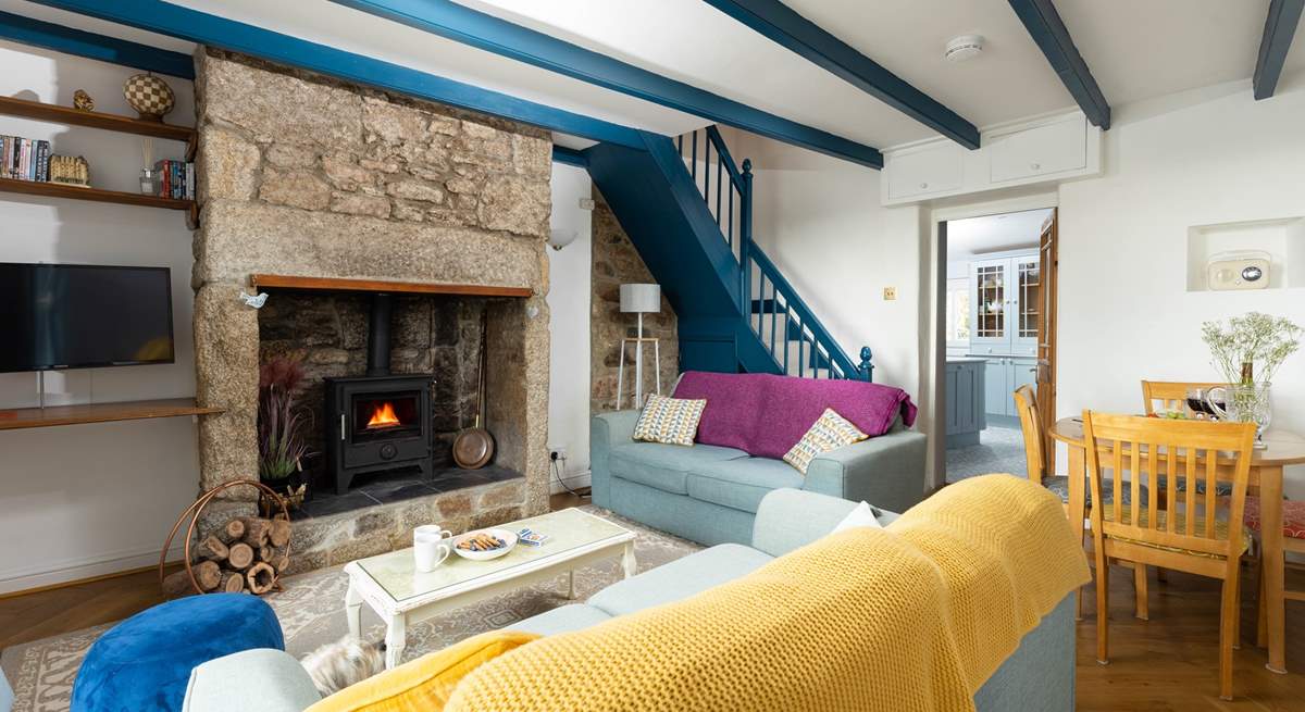 The front door opens into this cosy living space, up the steep cottage stairs are the two bedrooms. 