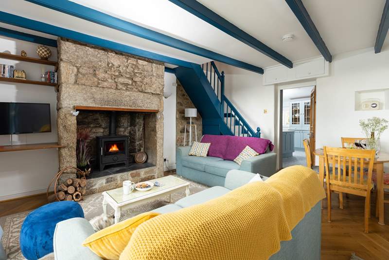 The front door opens into this cosy living space, up the steep cottage stairs are the two bedrooms. 