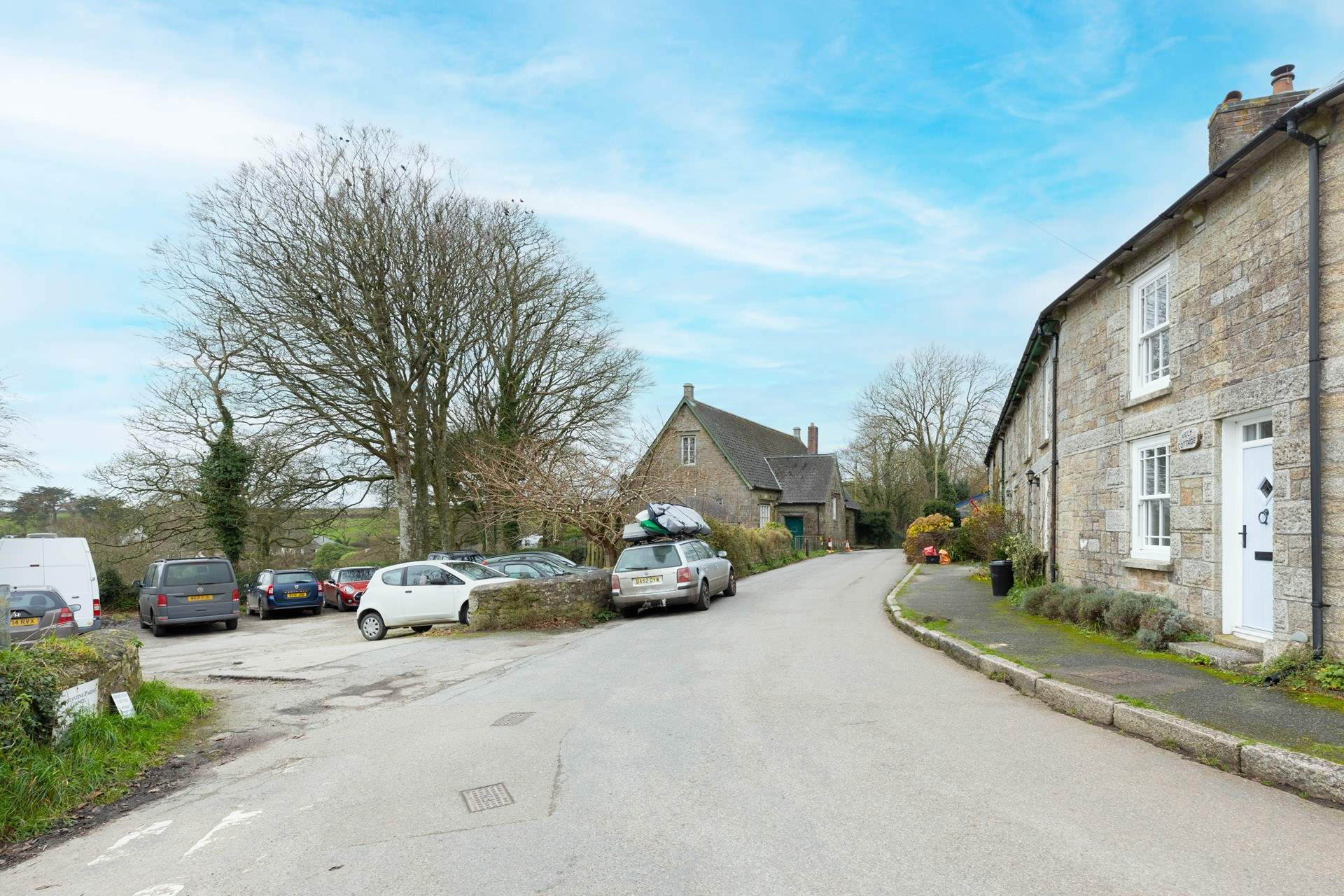 There is a free car park opposite July Cottage. 