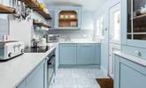 The kitchen, in hues of powder blue, has everything you need.  - Thumbnail Image