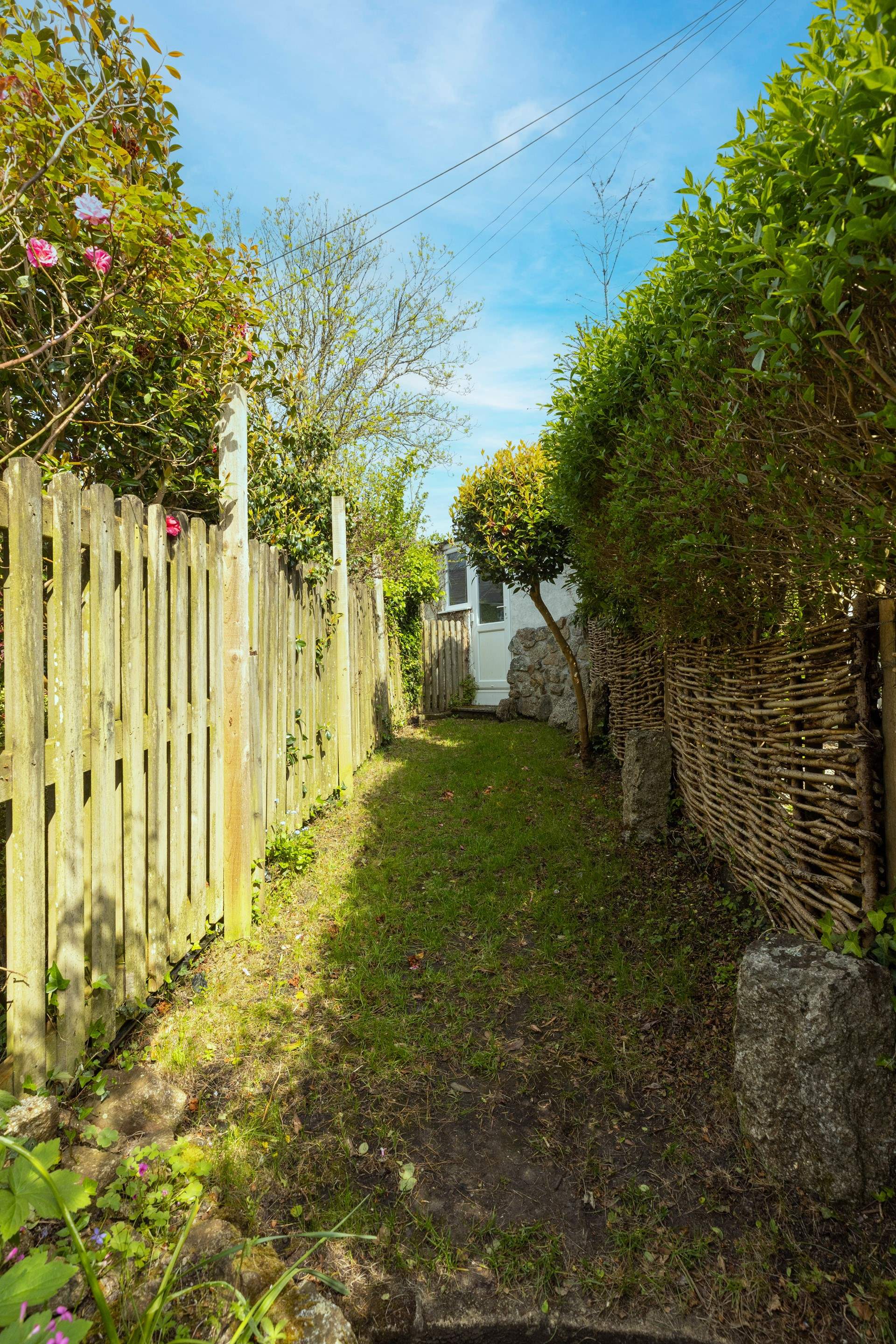 The little lawn is perfect to kick a ball about in. 