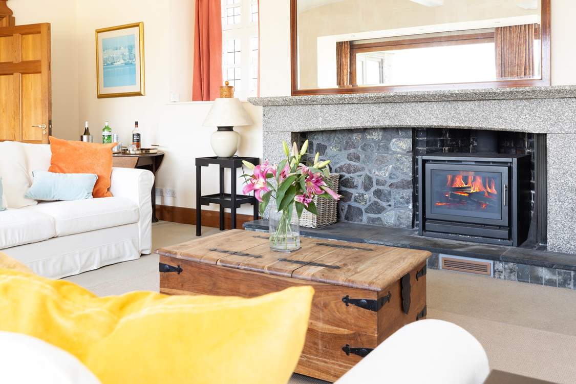 There is oodles of space for everyone to relax around the fire.