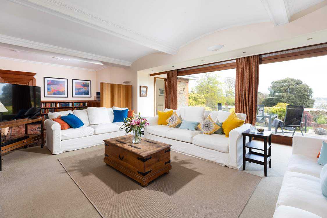 Huge sliding sliding doors open to the patio and walled garden. Bedroom 1 also leads off the corner of the sitting-room.