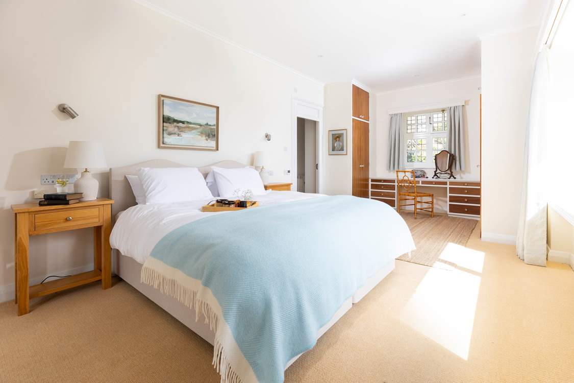 The principal bedroom on the ground floor can be a super-king or twin beds and has an en suite bathroom too as well as sea views!