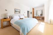 The principal bedroom on the ground floor can be a super-king or twin beds and has an en suite bathroom too as well as sea views!