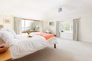 This bedroom on the first floor has a lovely king-size bed and views you will struggle to drag yourself from in the mornings.