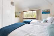 This bedroom has lovely views over the old kitchen garden.
