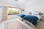 The sweet twin bedroom on the first floor is tucked away at the back of the cottage and is ever so cosy.
