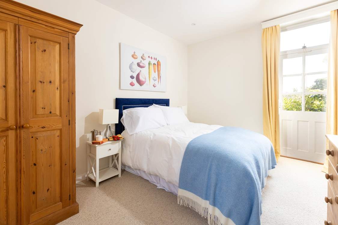 The double bedroom on the ground floor has its own en suite shower-room.
