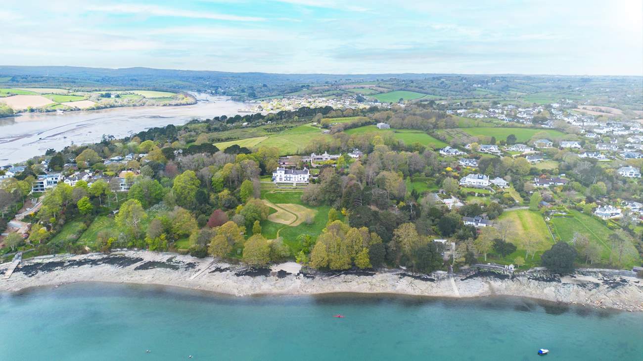 The Clock House is at the centre of the photos and has access to a private beach and slipway.