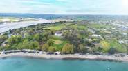 The Clock House is at the centre of the photos and has access to a private beach and slipway.