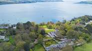 Welcome to The Clock House, it is the property at the bottom of the photo with the walled garden.
